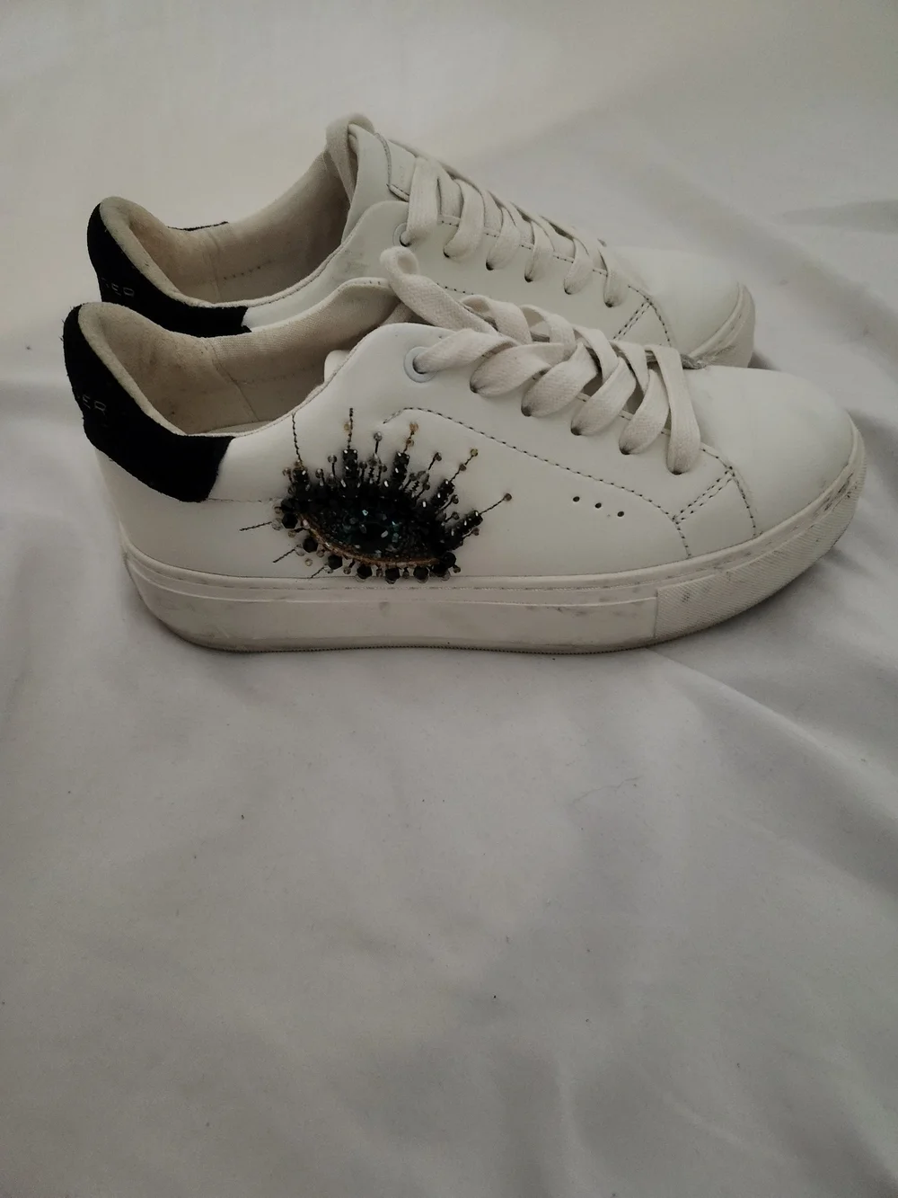 Kurt Geiger White Low-Top Sneakers with Black Heel and Embellishment